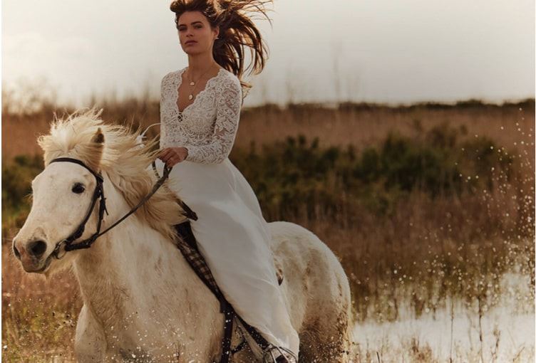 Model wearing a white Boho bridal gown